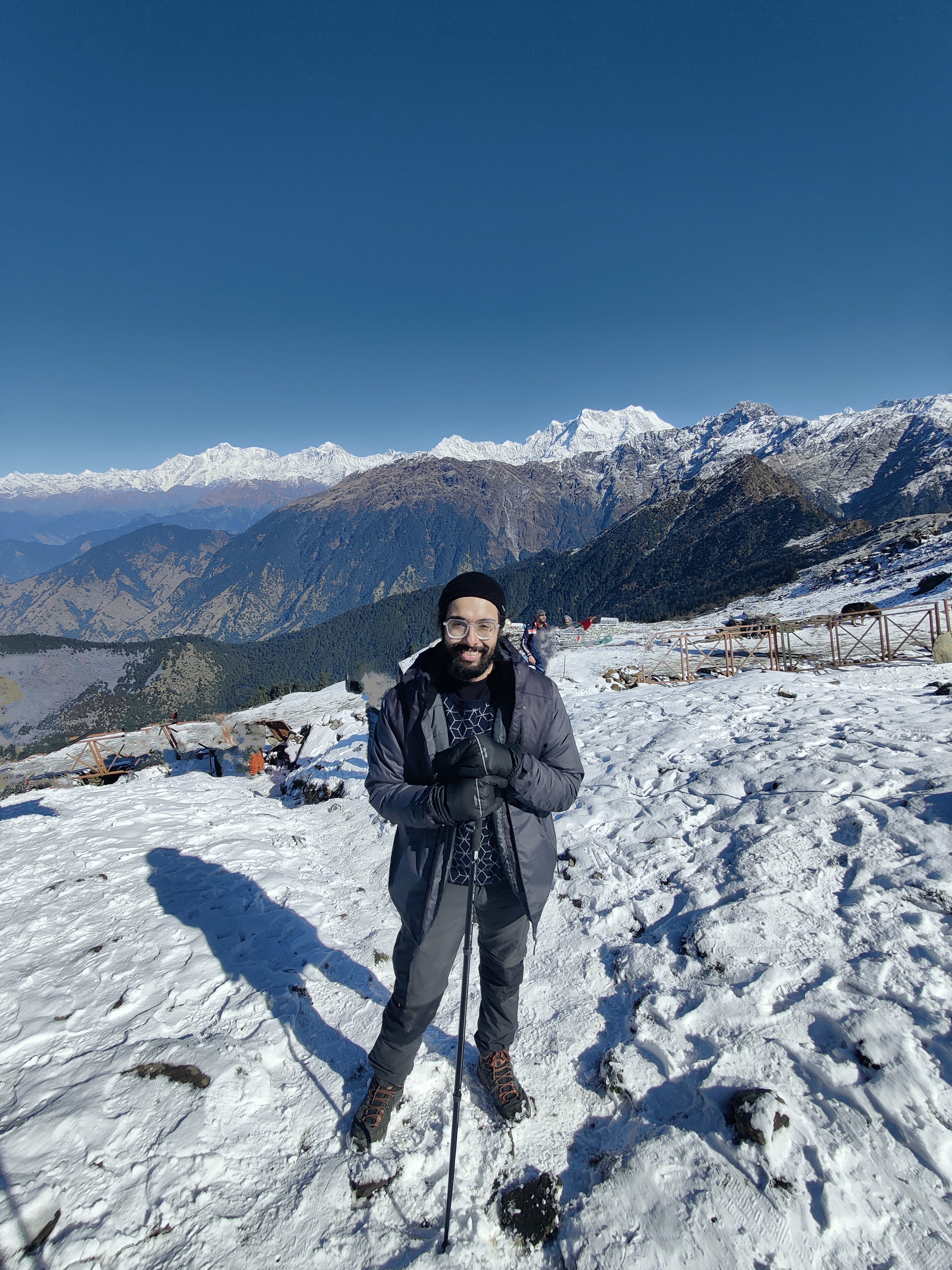 Jaskaran on a snowy mountain, in trekking gear